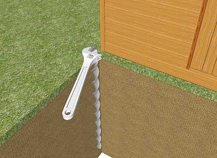 Enlever notre ancrage au sol d'un abri de jardin.